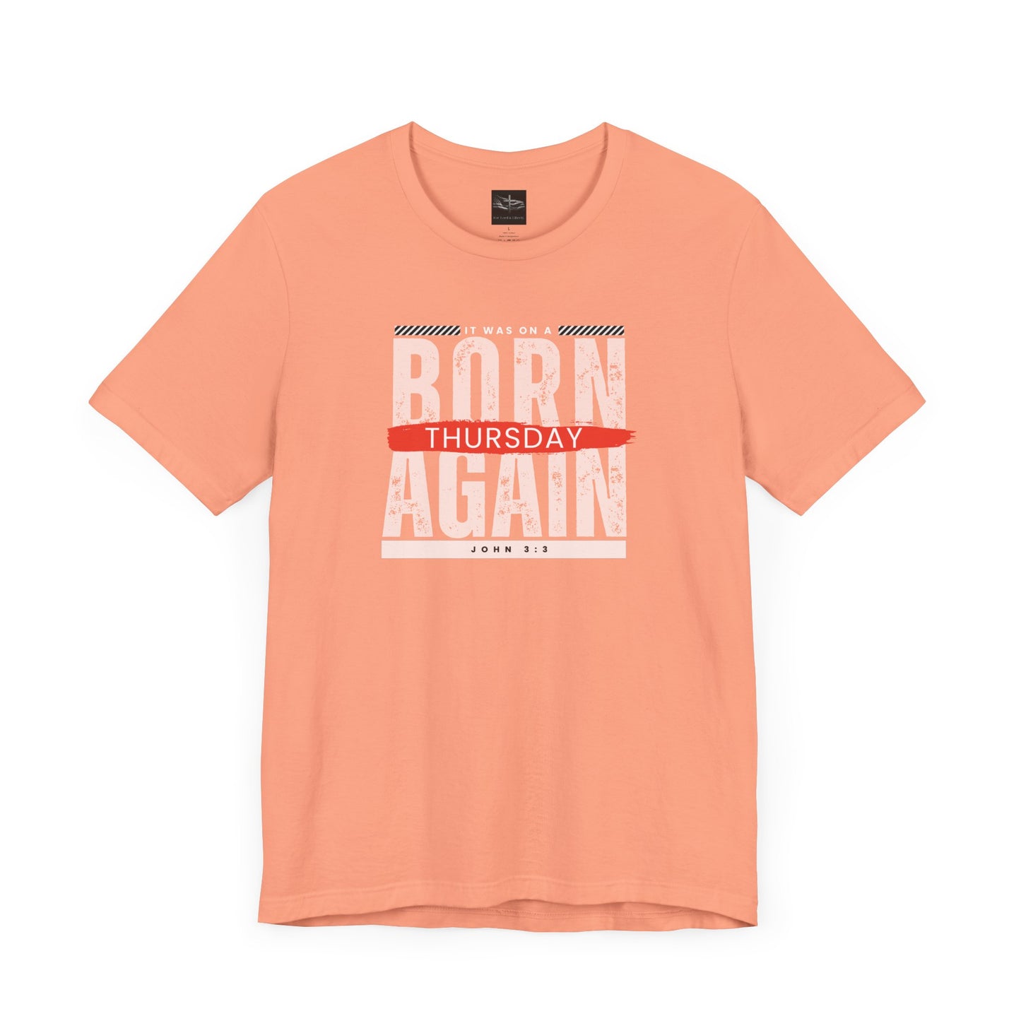 A orange t-shirt with the words Born Again it was on a Thursday with the scripture John 3:3