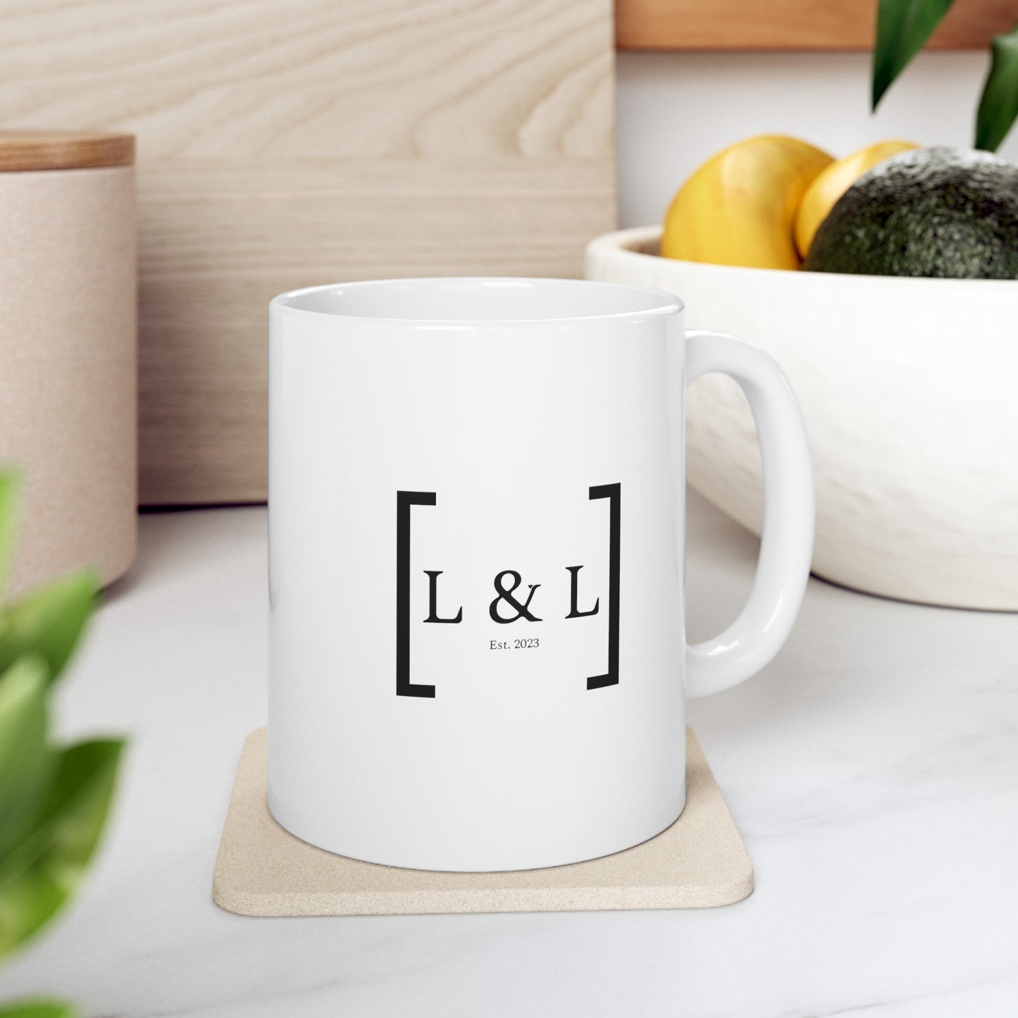 a white mug with the for lord and liberty logo that is sitting in the kitchen counter