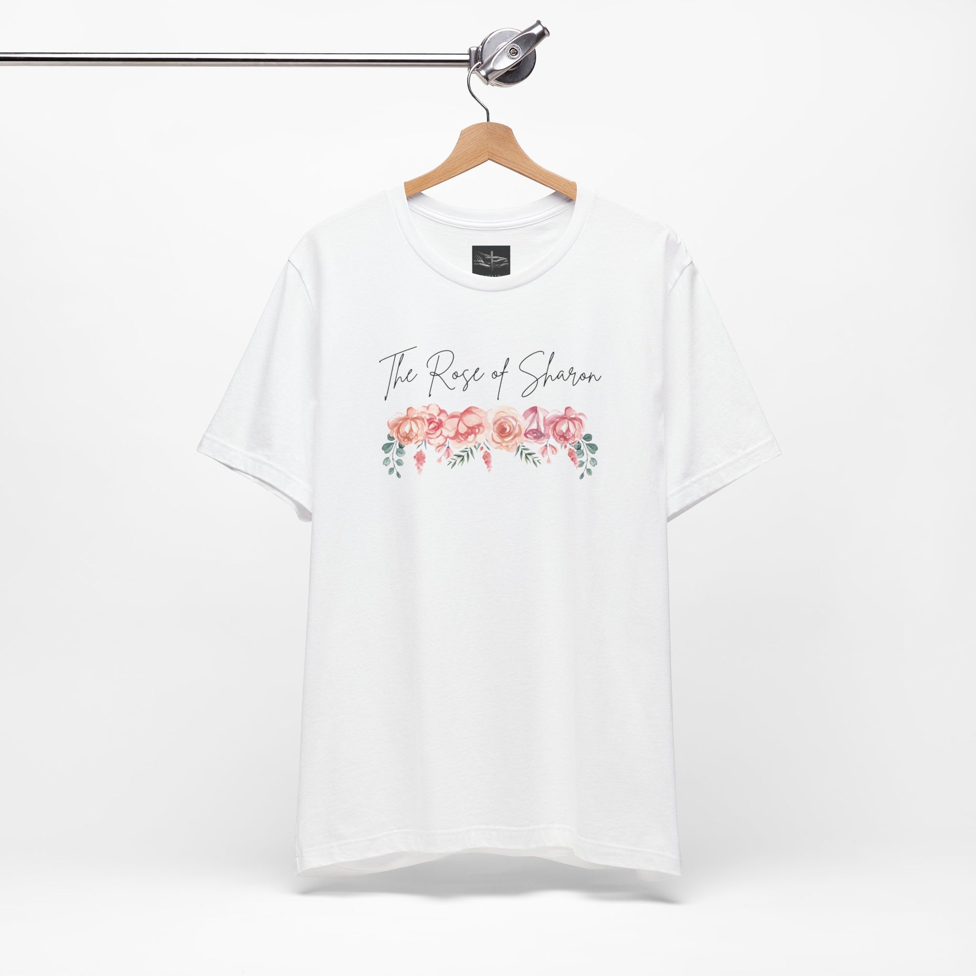 A white t-shirt with the words Rose of Sharon with a picture of roses