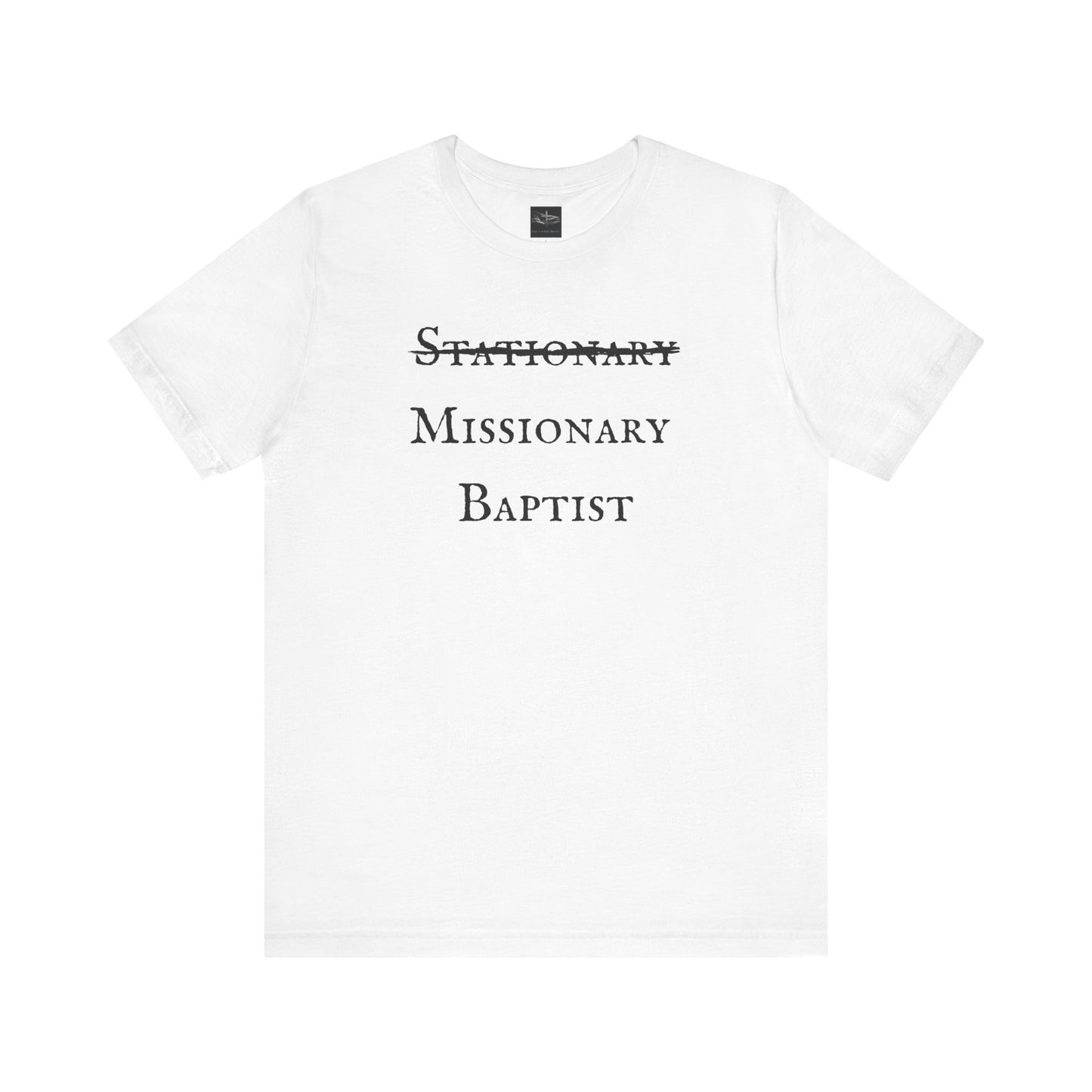 A white t-shirt with the word Stationary marked out with the words Missionary Baptist in bold