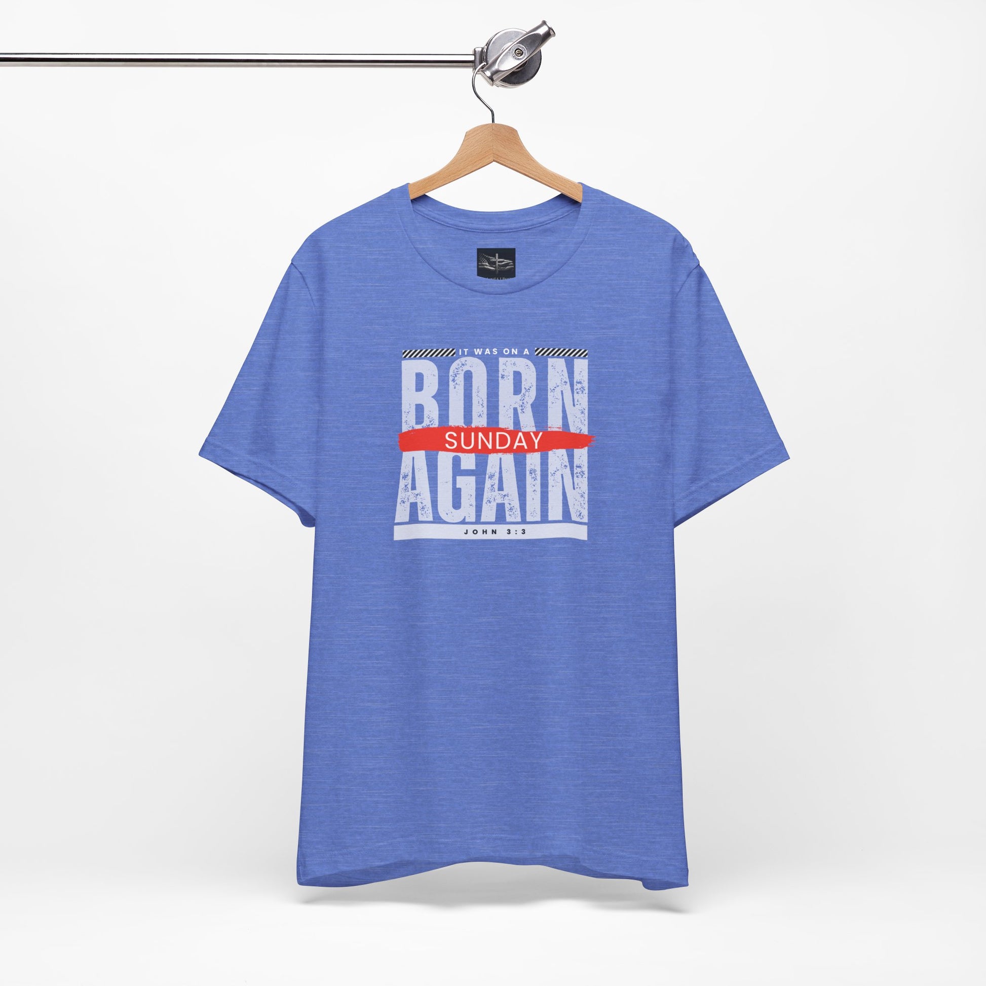 A blue t-shirt with the words Born Again it was on a Sunday with the scripture John 3:3