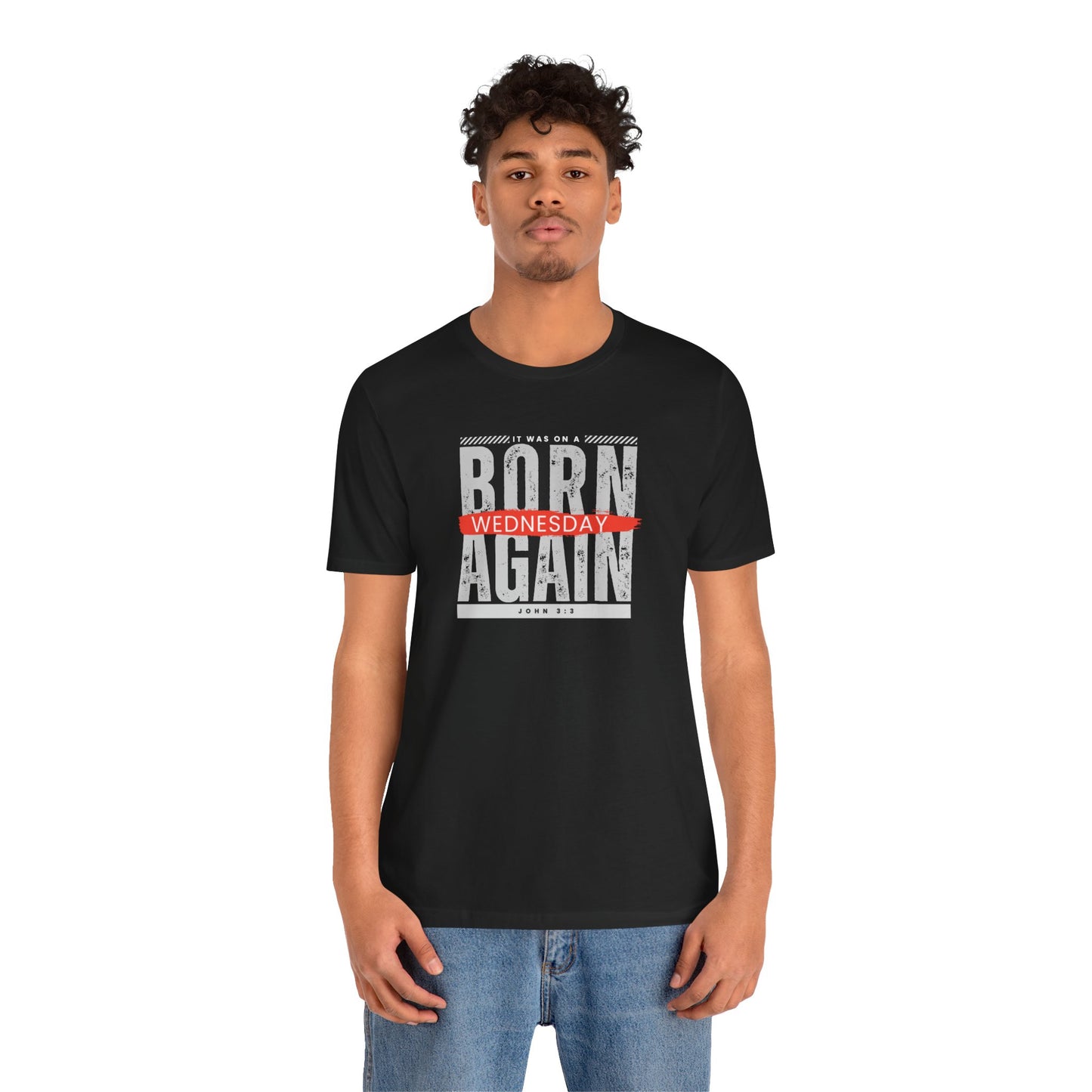 A black male wearing a black t-shirt with the words Born Again it was on a Wednesday with the scripture John 3:3