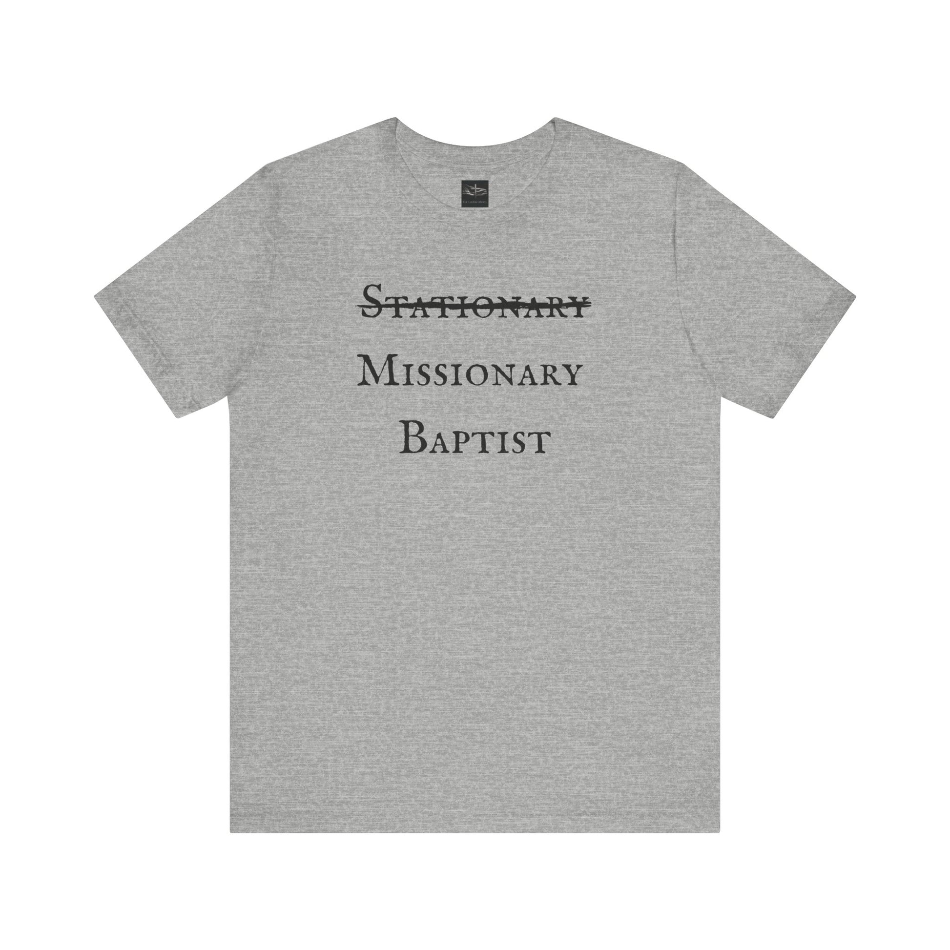 A athletic heather gray t-shirt with the word Stationary marked out with the words Missionary Baptist in bold