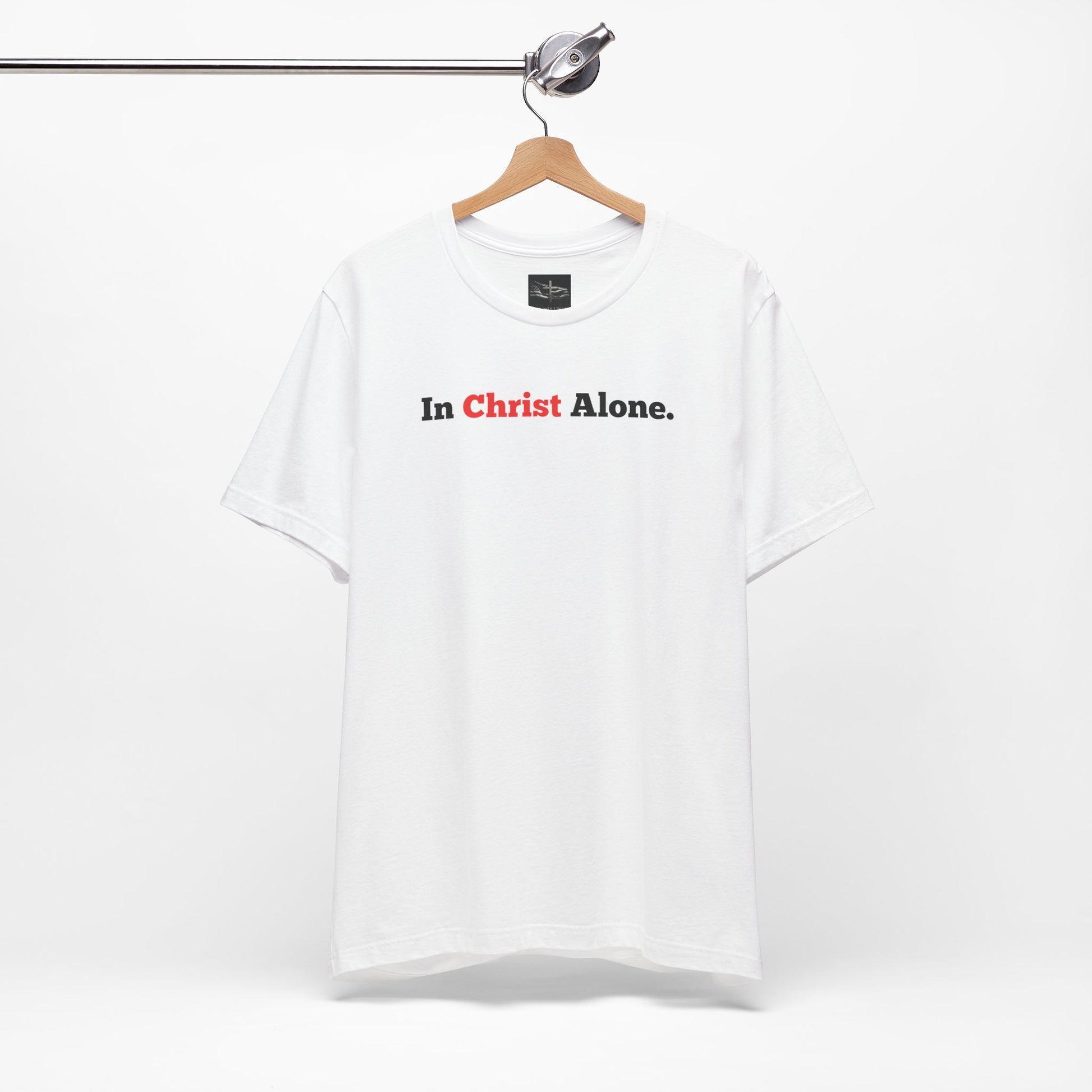 A white t-shirt with the words In Christ Alone