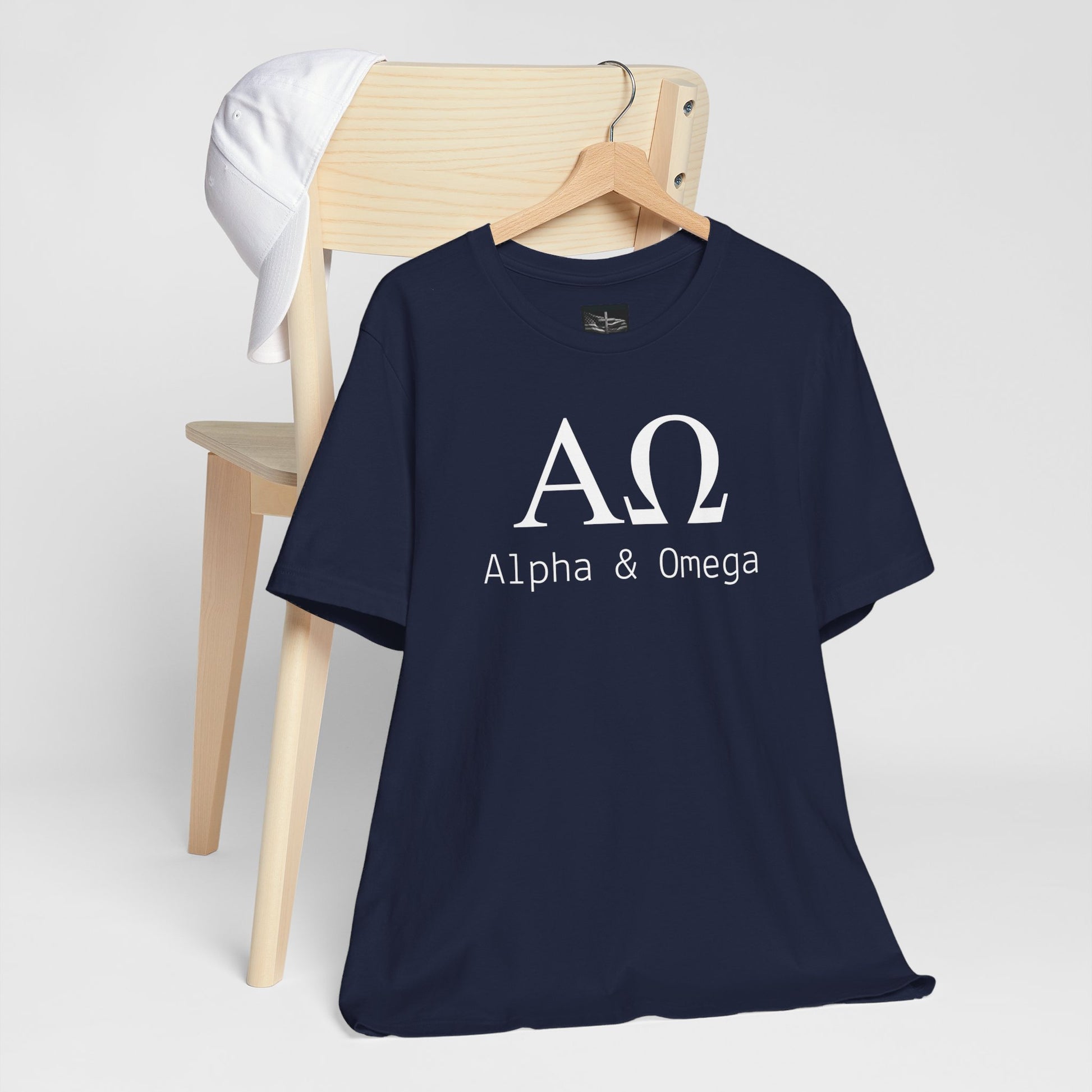 A navy t-shirt with the Greek symbols alpha and omega