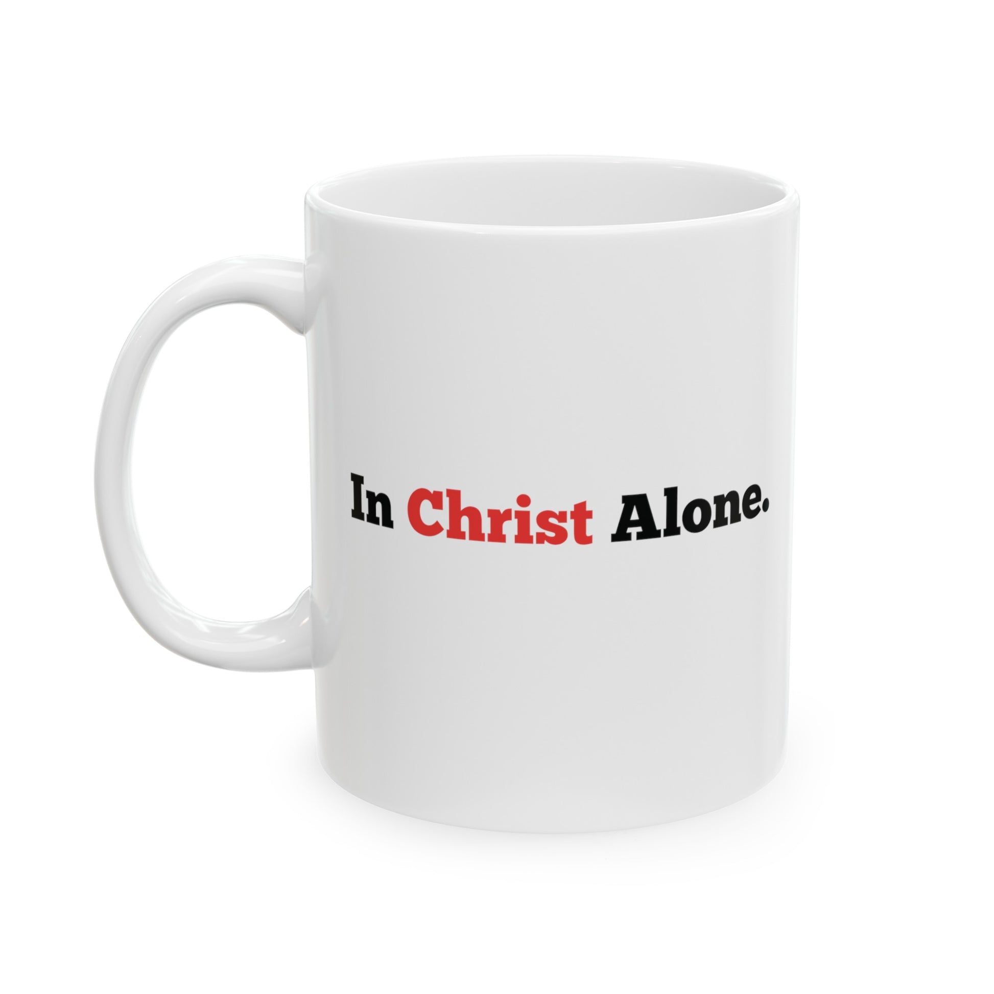 a white mug that says In Christ Alone