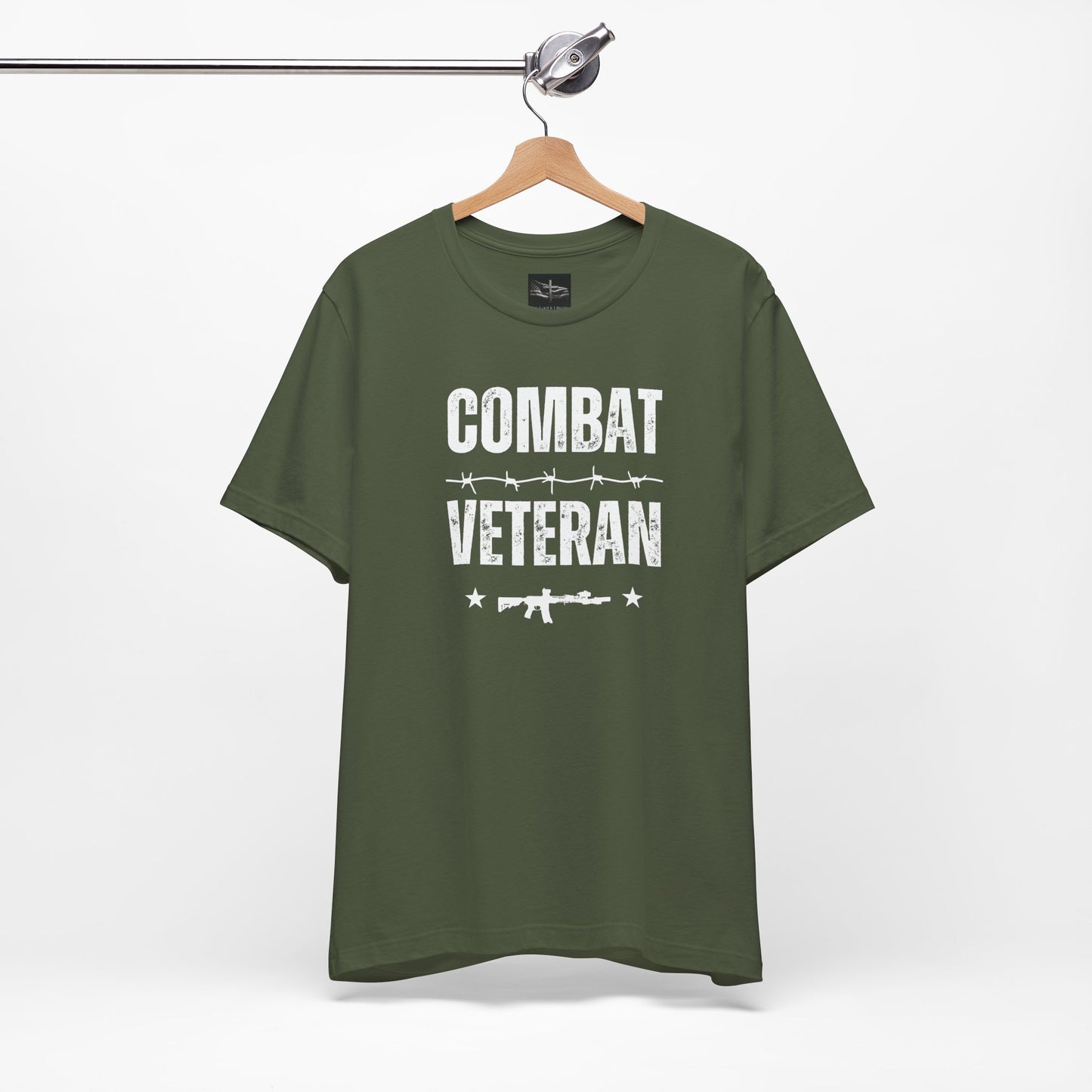 A military green t-shirt with the words combat veteran that includes a m-4 rifle, stars, and barb wire