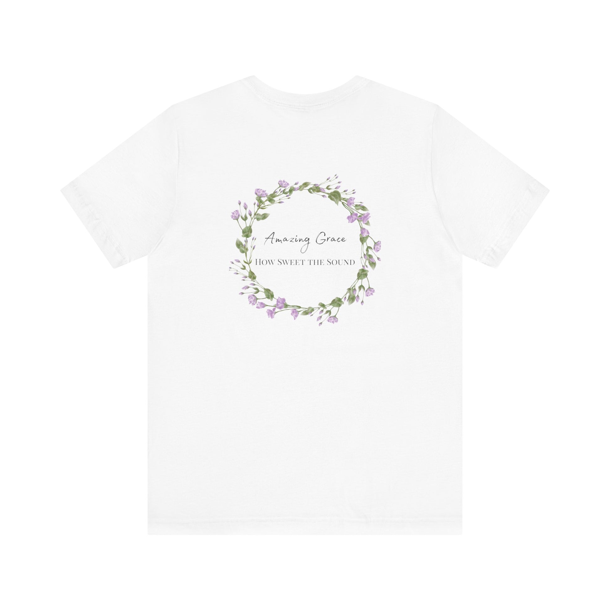 A white t-shirt with the words Amazing Grace how sweet the sound on the back of a t-shirt surrounded by a flower wreath