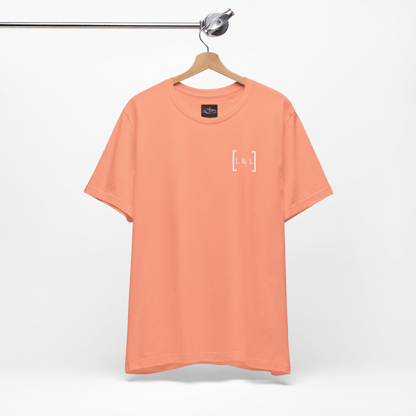 A orange t-shirt with the words L&L established 2023 on the left pocket