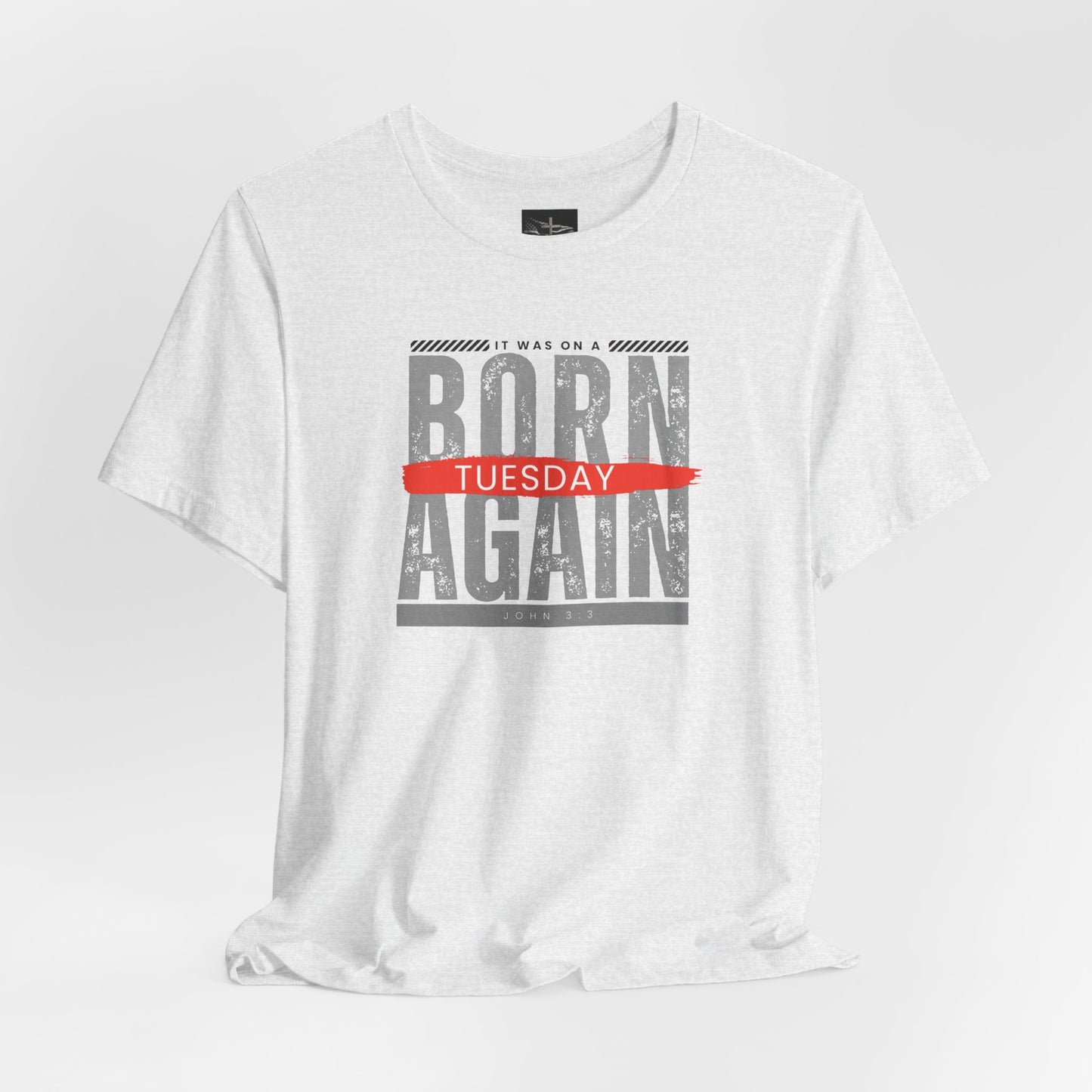 A ash t-shirt with the words Born Again it was on a Tuesday with the scripture John 3:3