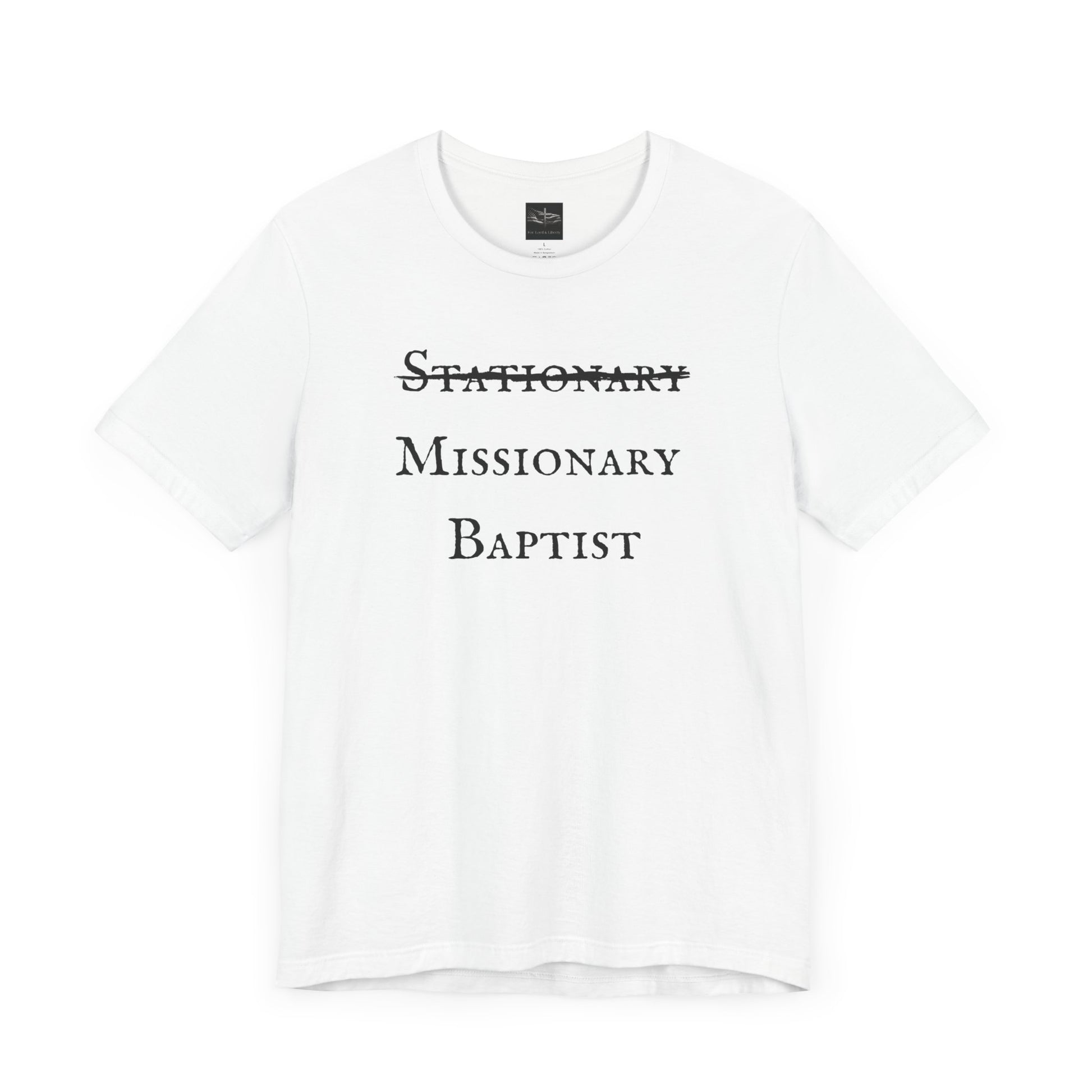 A white t-shirt with the word Stationary marked out with the words Missionary Baptist in bold