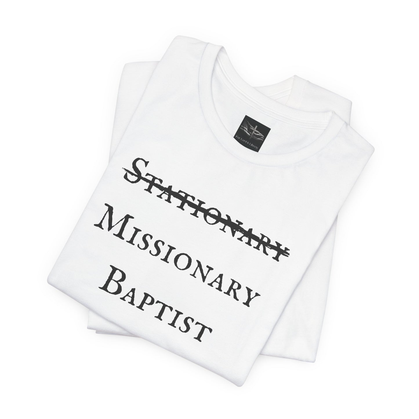 A white t-shirt with the word Stationary marked out with the words Missionary Baptist in bold