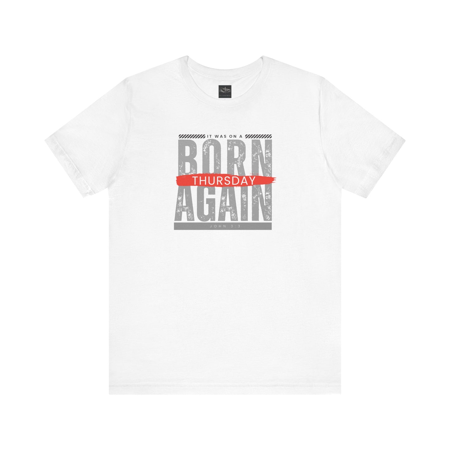 A white t-shirt with the words Born Again it was on a Thursday with the scripture John 3:3