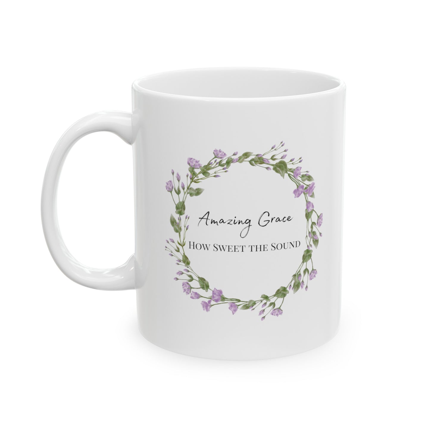 a white mug with the words Amazing Grace How Sweet the Sound written in black with a flower wreath around the words