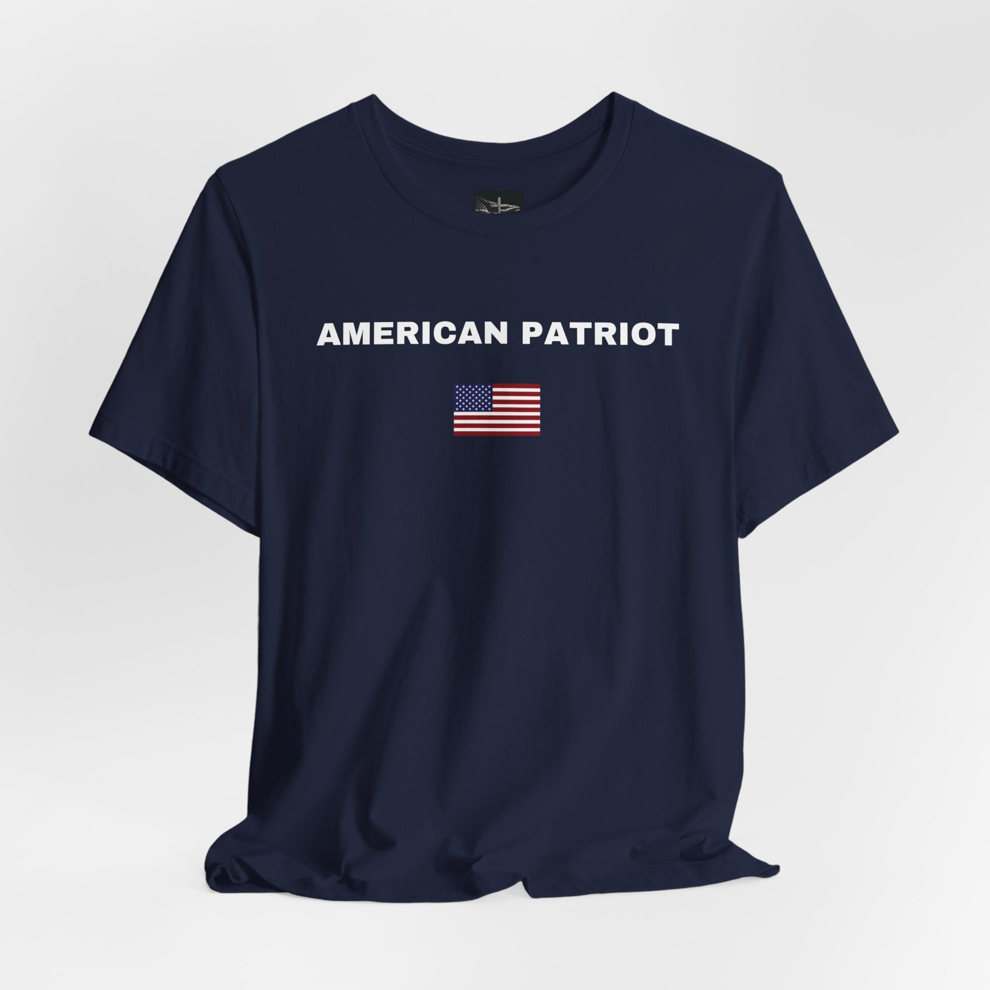 A navy t-shirt with the words American Patriot in white with an American flag