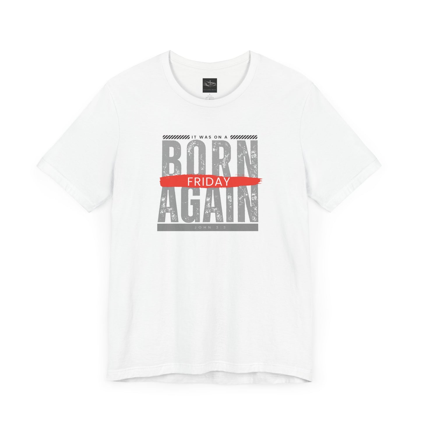 A white t-shirt with the words Born Again it was on a Friday with the scripture John 3:3