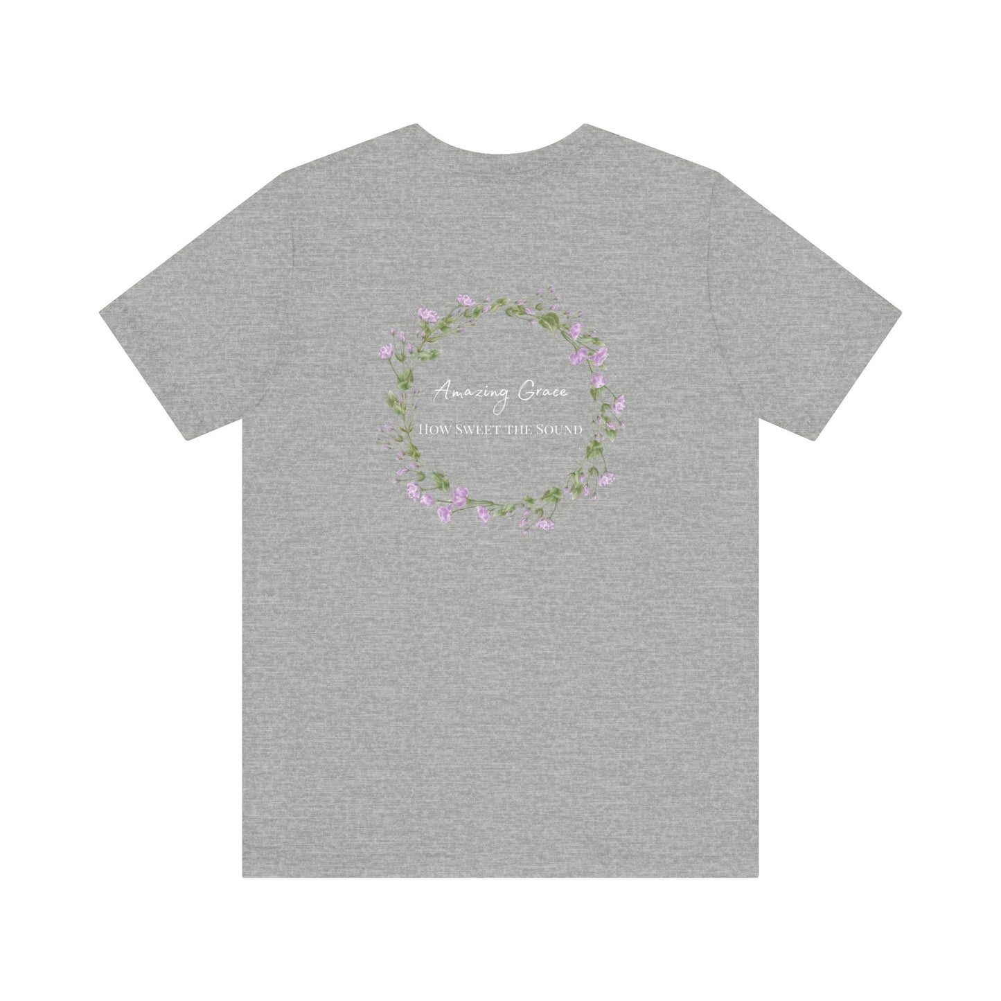 A gray t-shirt with the words Amazing Grace how sweet the sound on the back of a t-shirt surrounded by a flower wreath