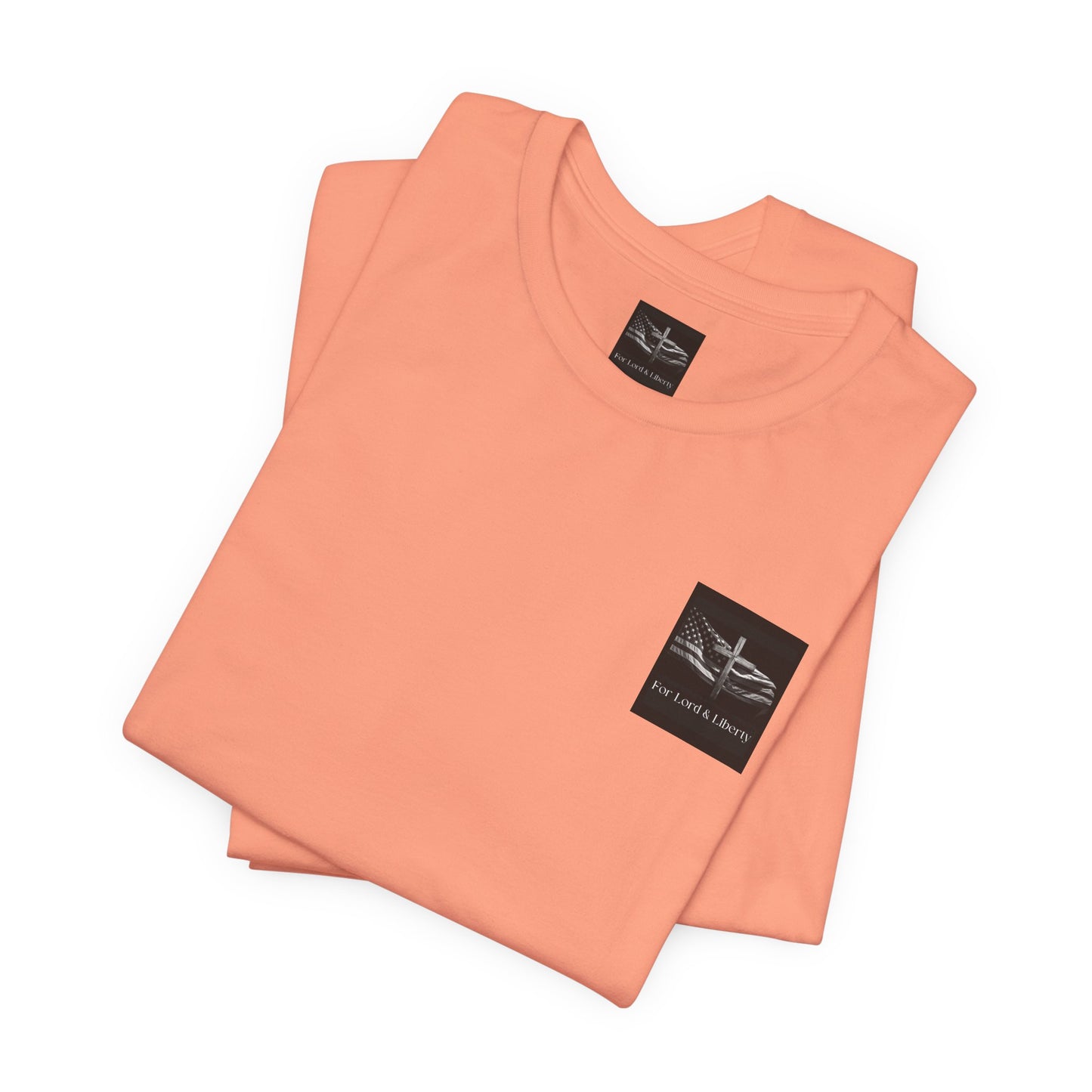 A sunset orange t-shirt with the For Lord & Liberty logo on the front left pocket