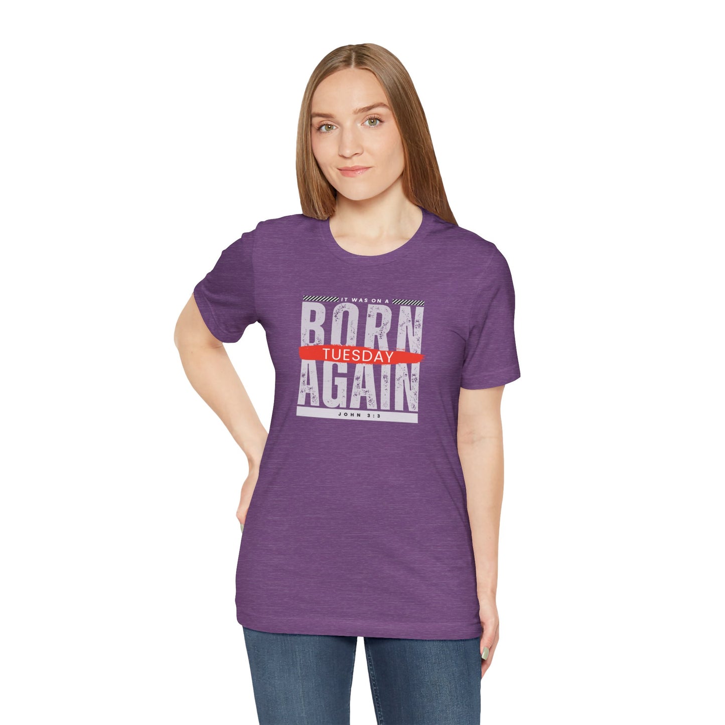 A female wearing a purple t-shirt with the words Born Again it was on a Tuesday with the scripture John 3:3