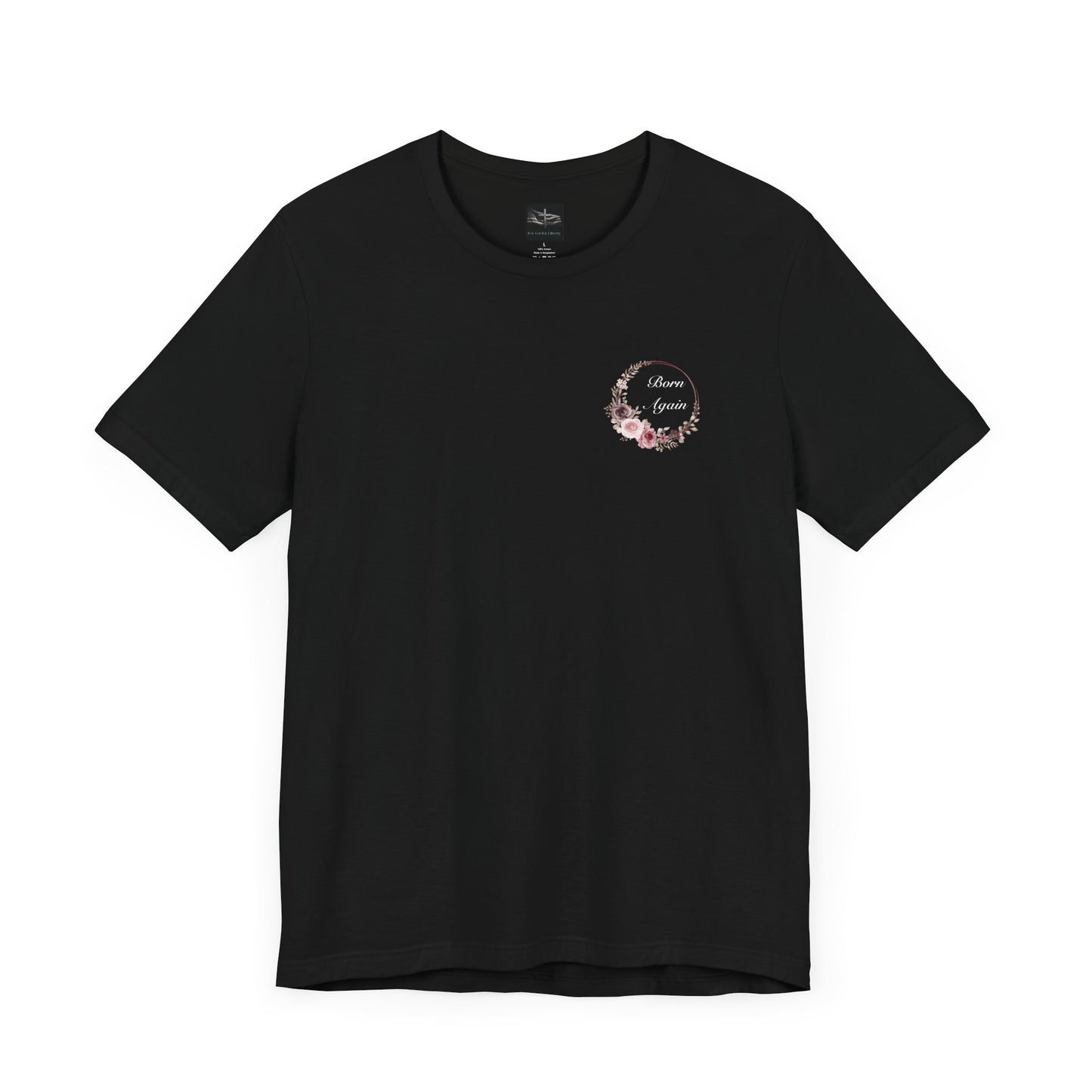 A black t-shirt with the words Born Again with a flower wreath on the front left pocket