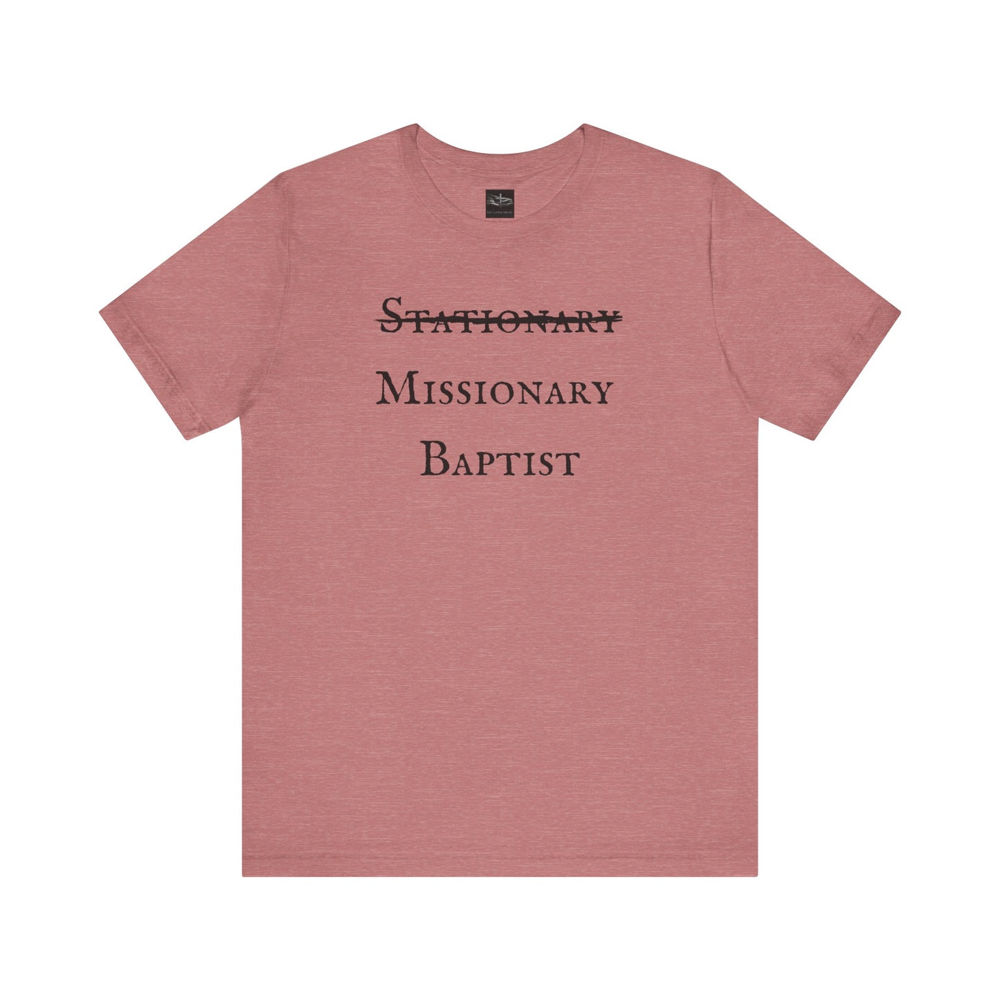 A heather muave t-shirt with the word Stationary marked out with the words Missionary Baptist in bold