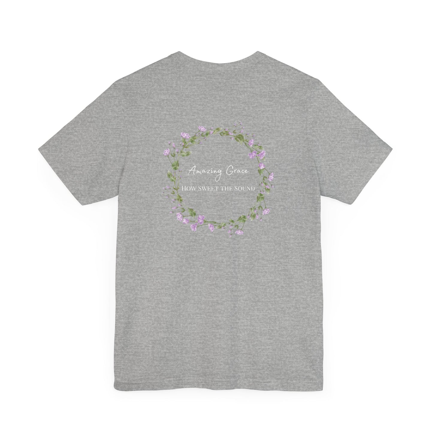 A gray t-shirt with the words Amazing Grace how sweet the sound on the back of a t-shirt surrounded by a flower wreath