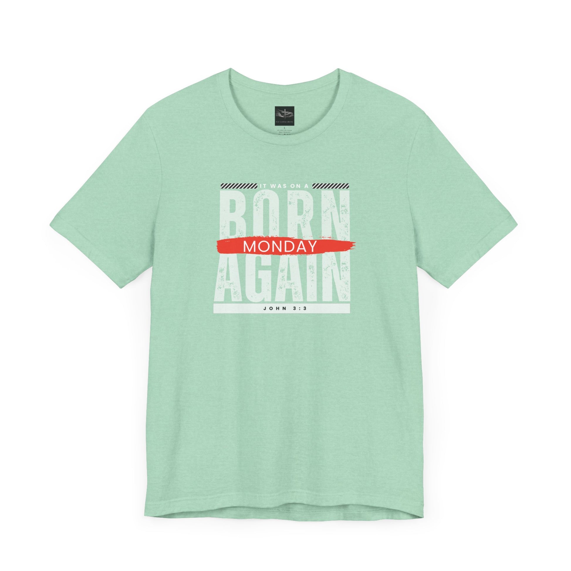 A green t-shirt with the words Born Again it was on a Monday with the scripture John 3:3