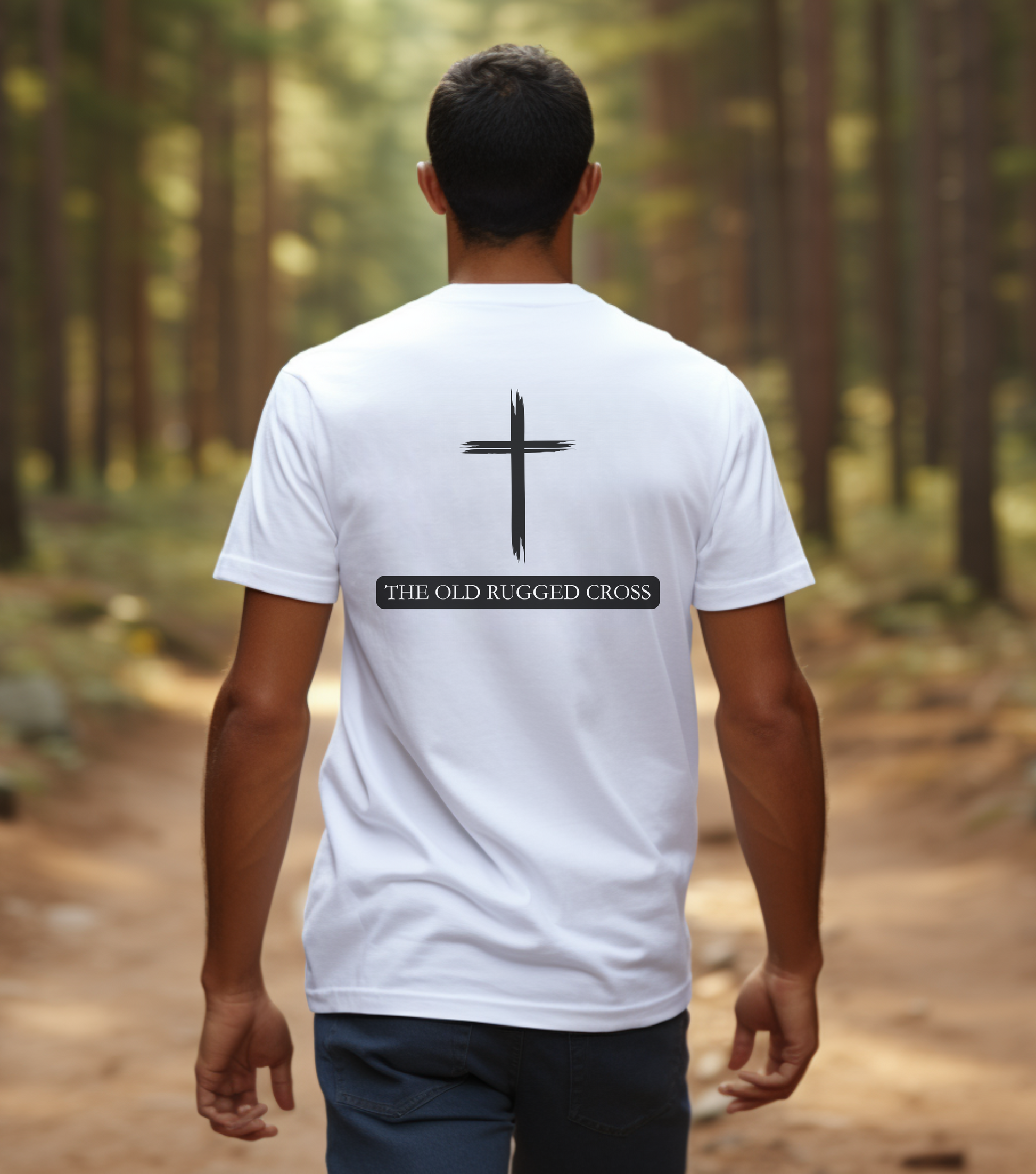 A male wearing a white t-shirt with a cross with the words The Old Rugged Cross